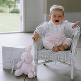 Emile et Rose  Florence is a beautiful baby girls’ all in one with a simple white rounded collar edged with pink piping.